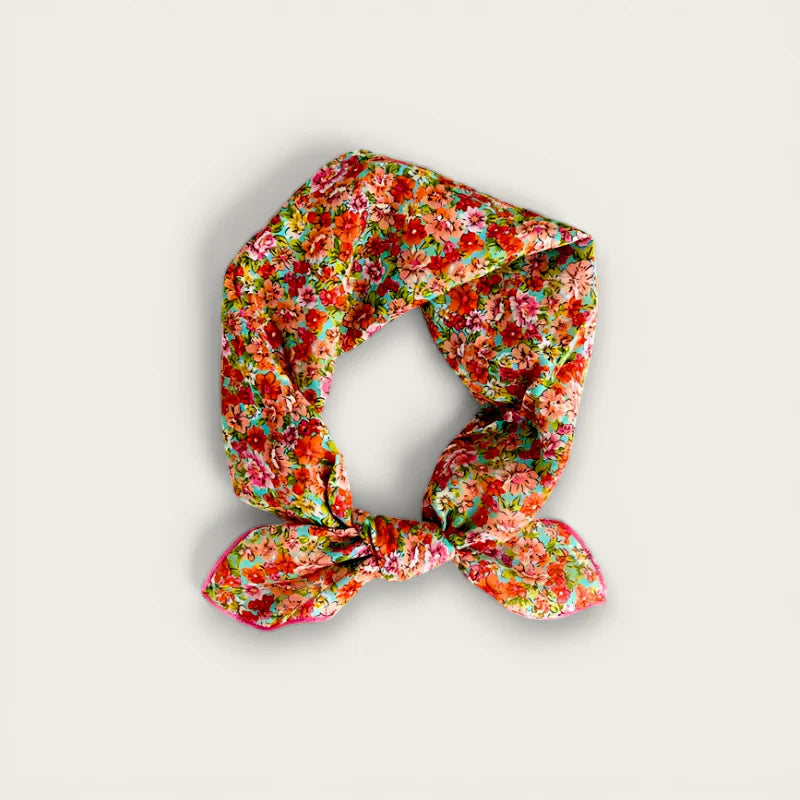 Lightweight cotton scarf with vibrant red pink floral pattern on mint green