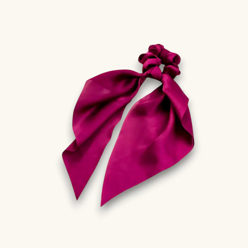 Vibrant magenta satin scarf scrunchie with flowing ribbon bow