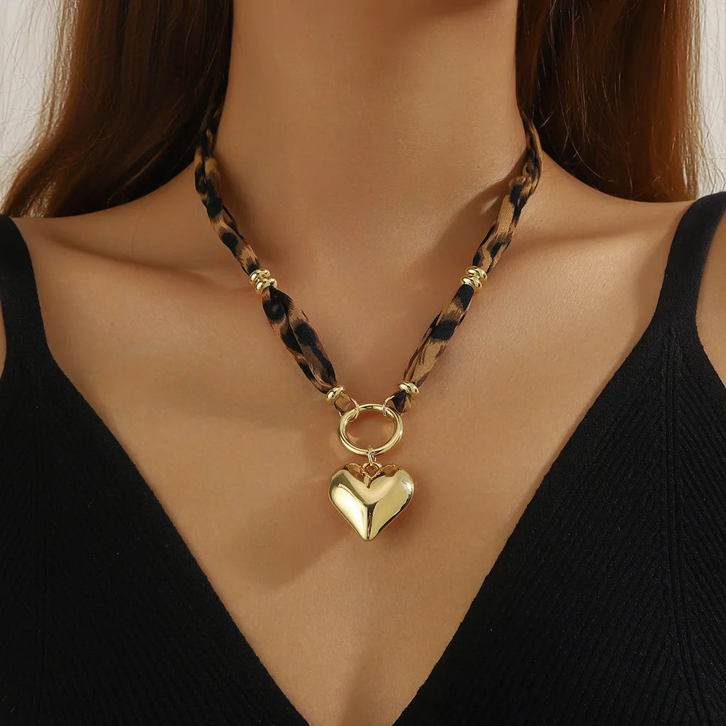 Maroon scarf necklace with gold heart pendant, leopard cord, gold hardware
