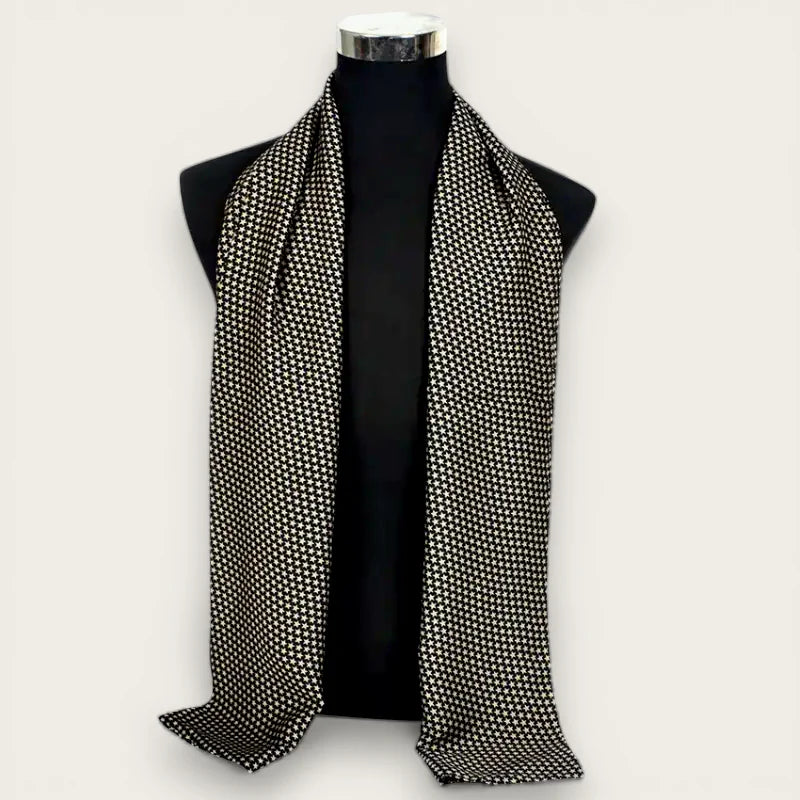 Mens long silk scarf in black and white houndstooth draped on mannequin