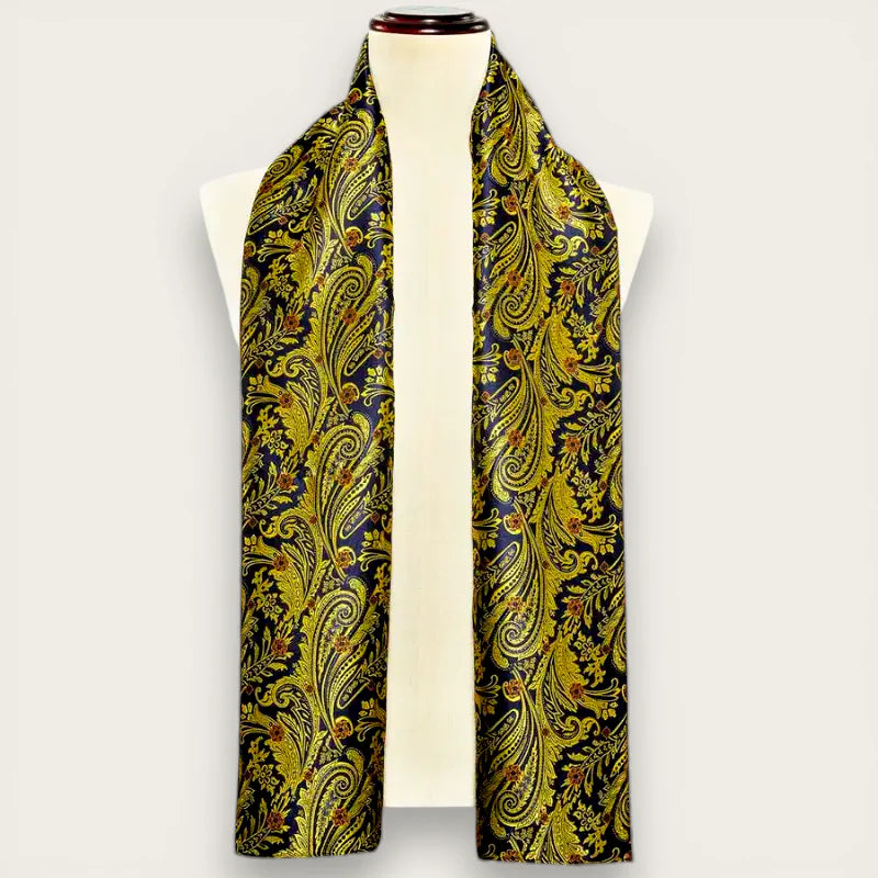 Elegant gold and black paisley silk scarf on mannequin