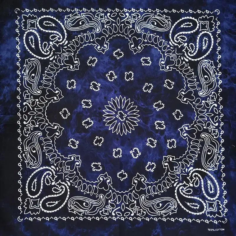 Navy blue bandana scarf with white paisley floral patterns and tie-dye texture