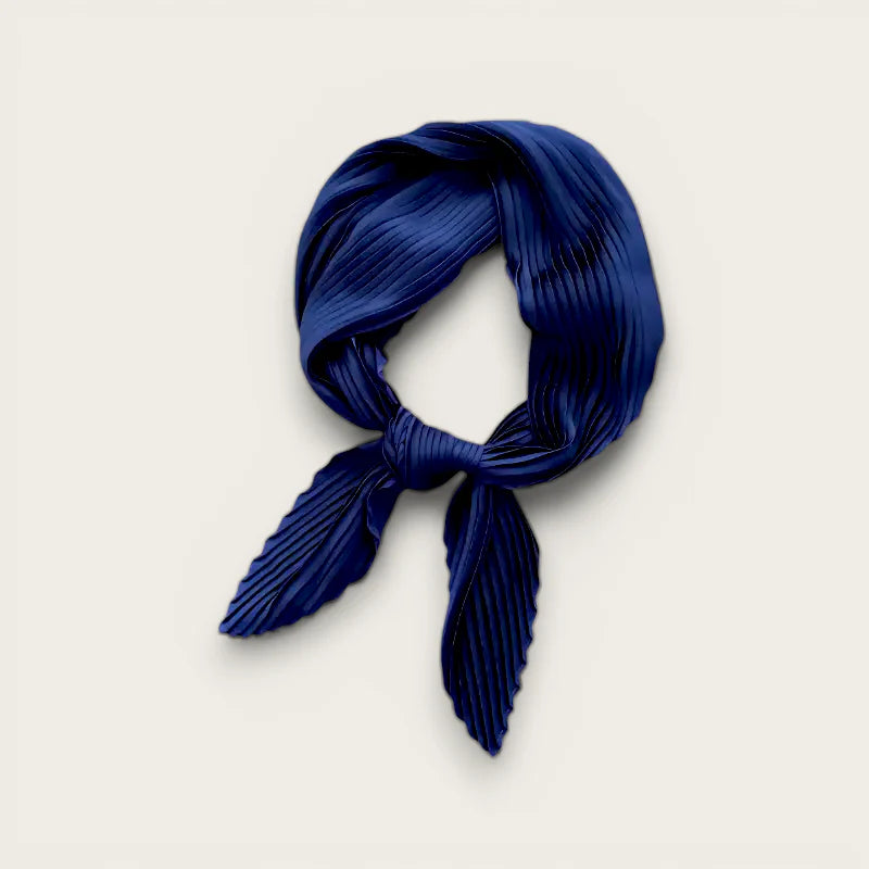 Navy blue pleated silk head scarf tied in a neat knot