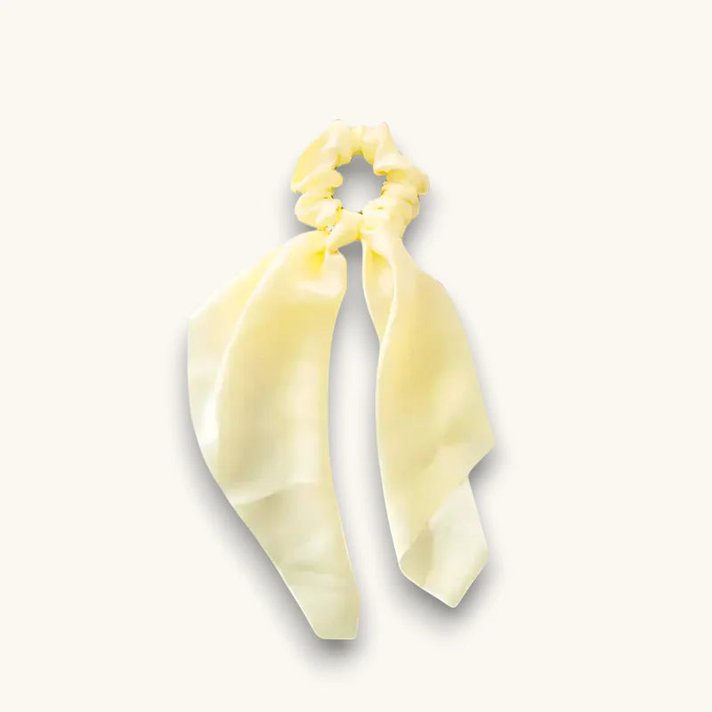 Off white scarf scrunchie in pale yellow satin with flowing ribbon tail