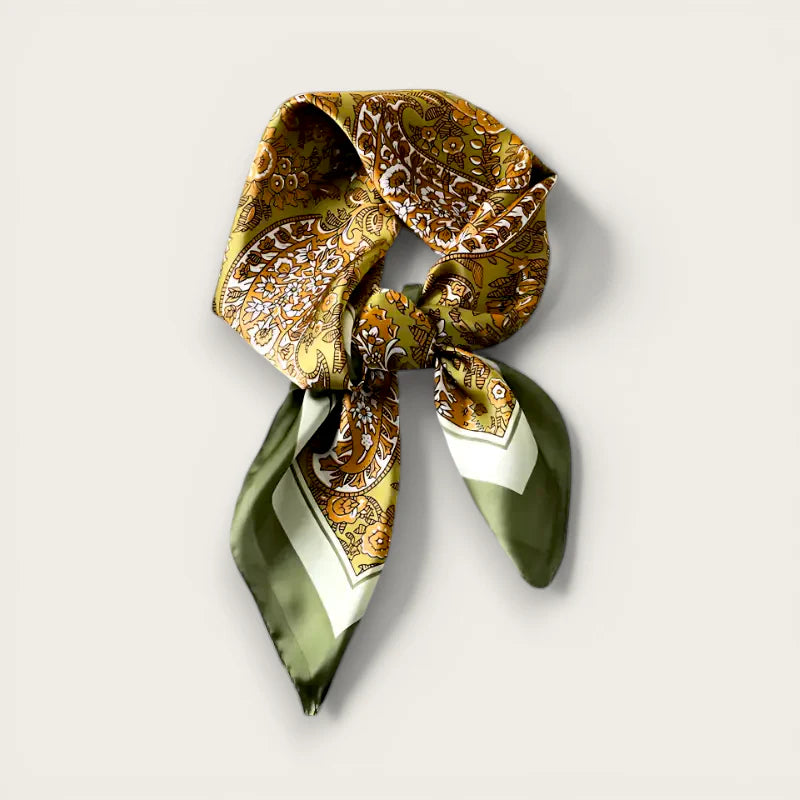 Luxurious olive gold paisley silk scarf knotted with white trim