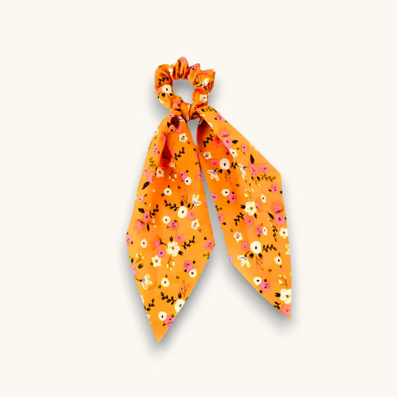 Orange red floral scrunchie with tied bow design