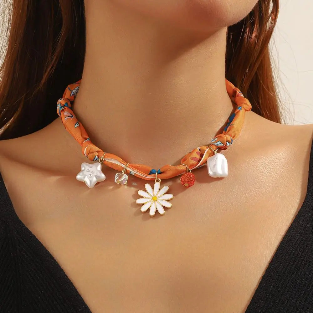 Orange patterned scarf choker necklace with daisy, star, pearl charms