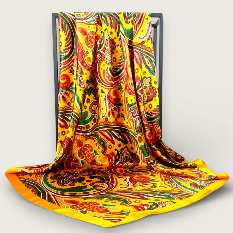 Oversized yellow silk scarf with vibrant bold paisley pattern