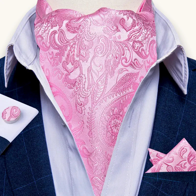 Pink paisley silk ascot tie on gray shirt and navy suit