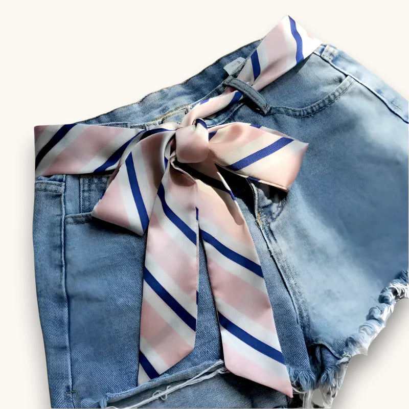 Pink Scarf Belt: pink and navy silk scarf tied as bow on denim shorts