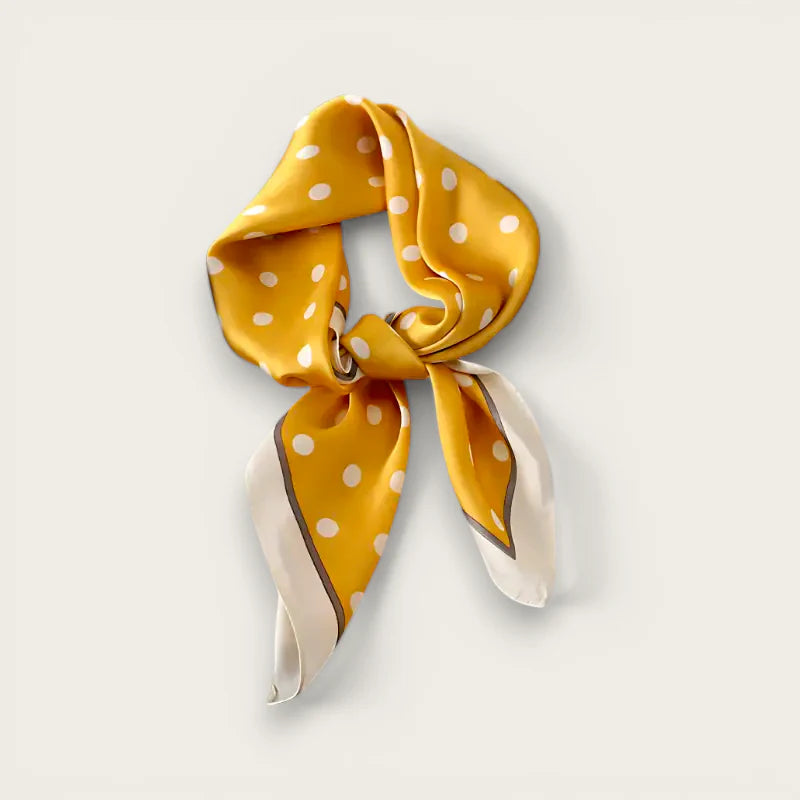 Vibrant yellow polka dot neck scarf with gray border in elegant knot