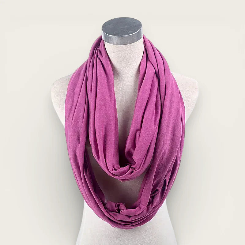 Purple infinity scarf in soft magenta draped on mannequin neck