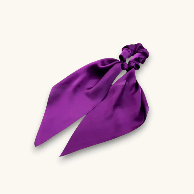 Purple scarf scrunchie with vibrant satin fabric, flowing ribbon tail