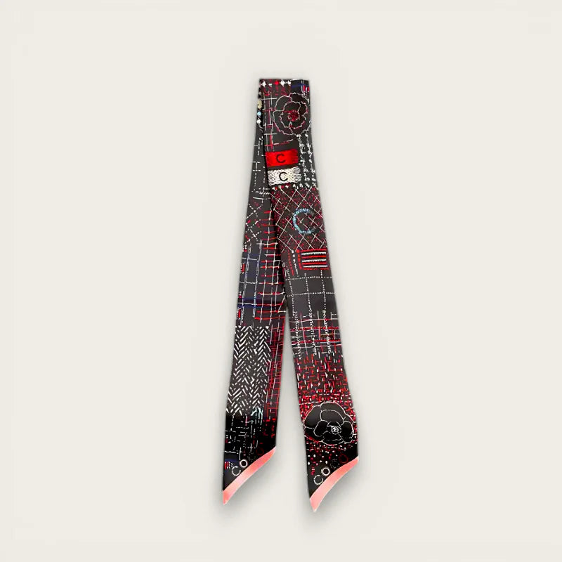 Red Handle Scarf: sleek black silk with bold red-white geometric floral print