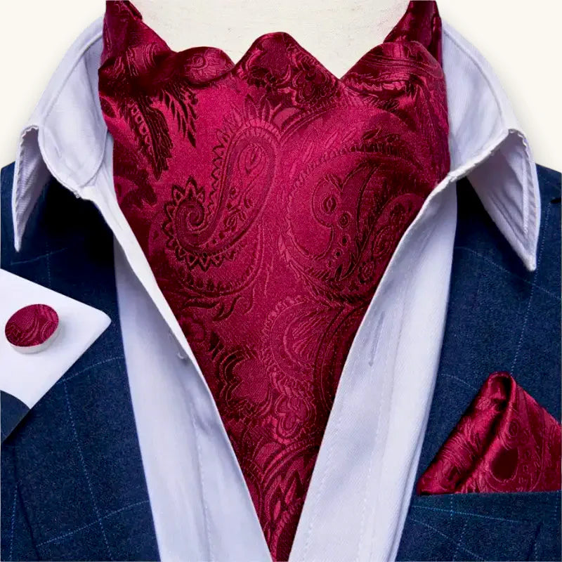 Red Paisley Ascot: burgundy satin cravat with intricate paisley on navy suit