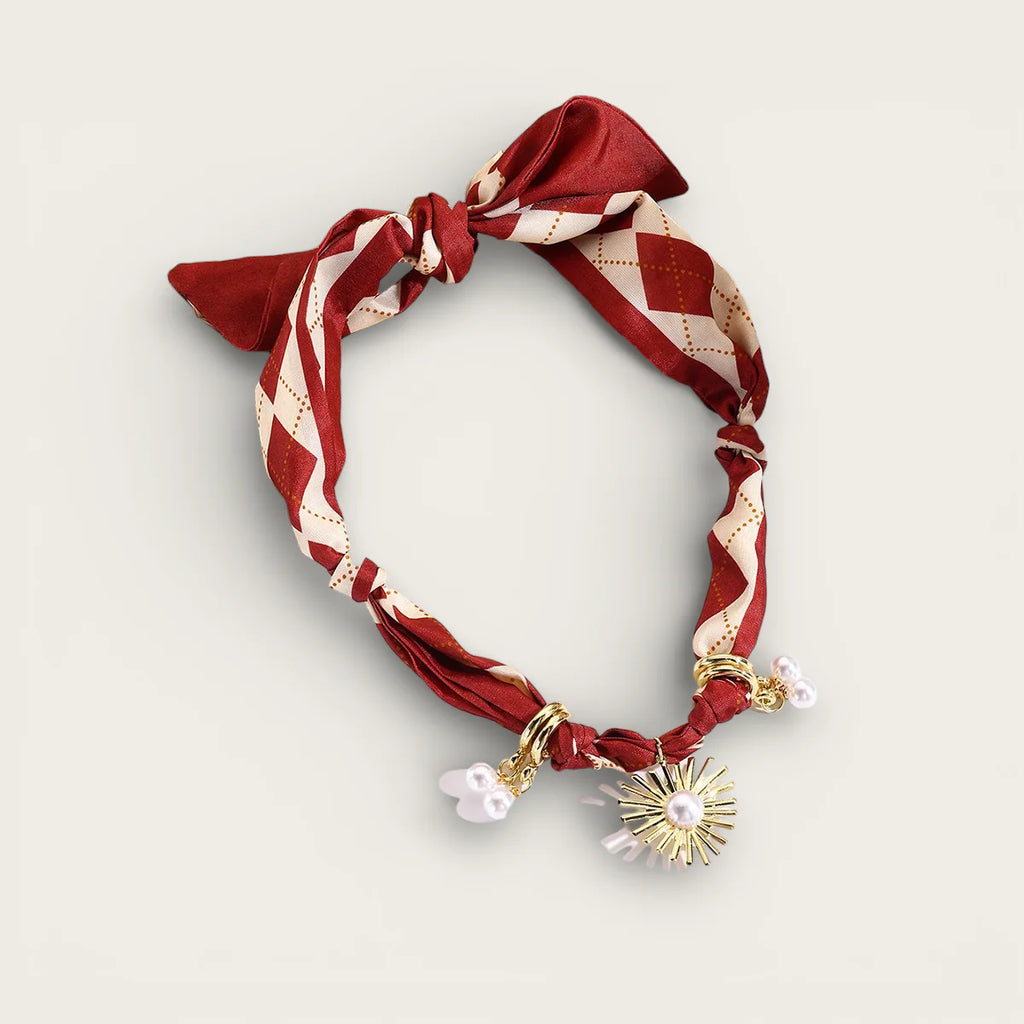 Red scarf necklace with cream argyle silk, knot, gold charms, pearls