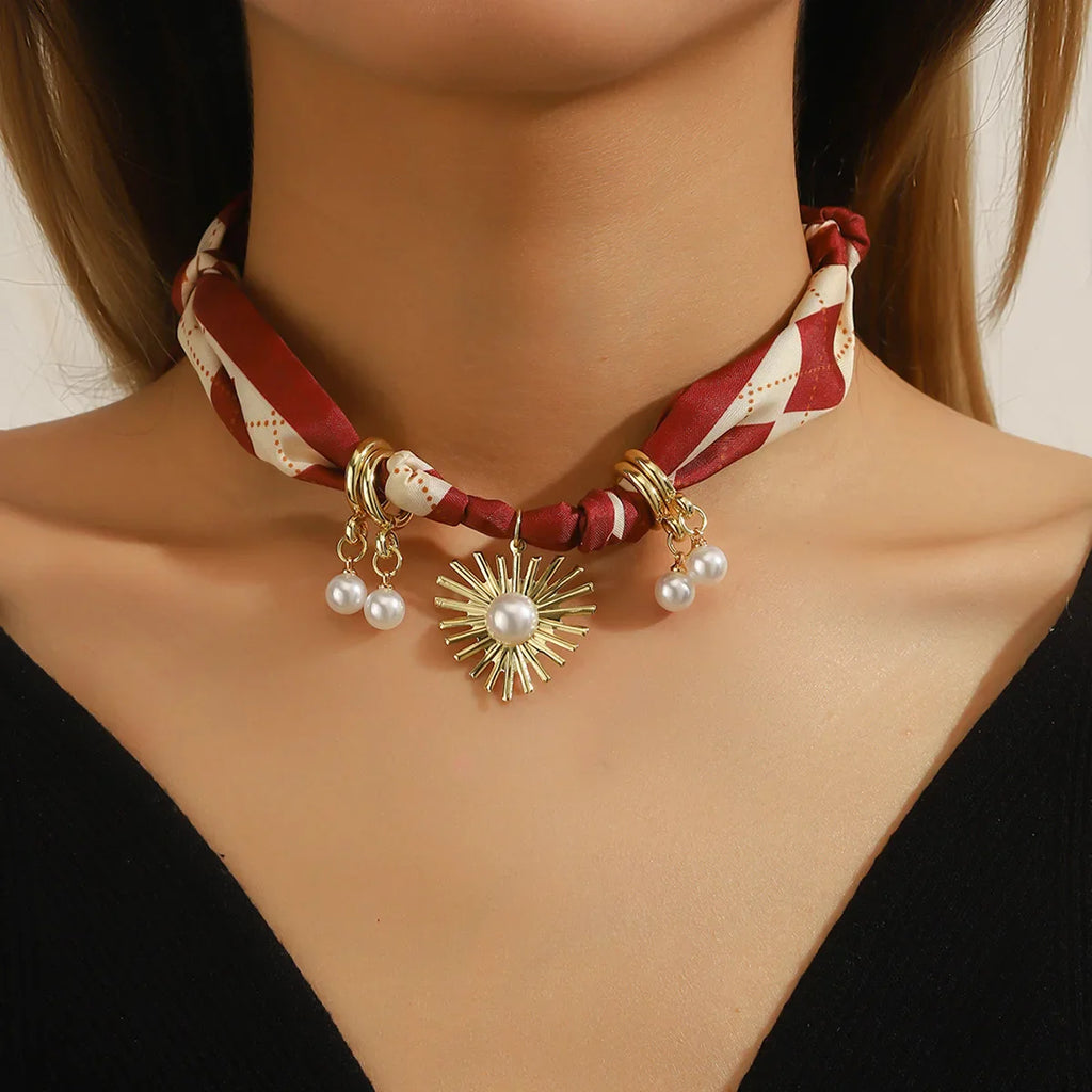 Red scarf necklace with silk choker, gold sunburst pearl pendant