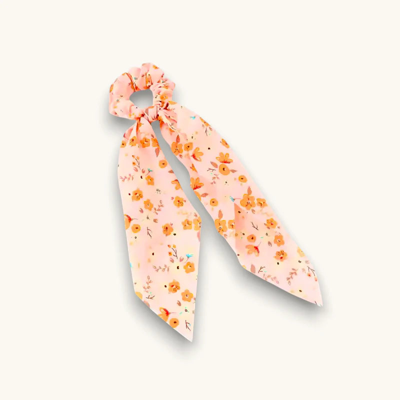 Ribbon Bow Scrunchie in soft pink floral fabric with tied bow
