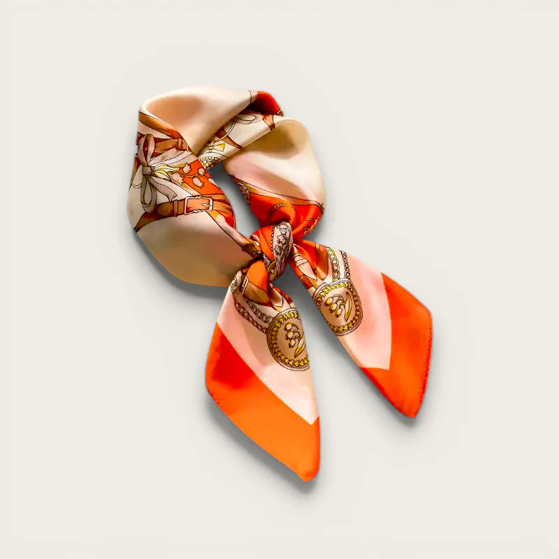 Vibrant orange cream satin hair scarf wrap with gold-embossed vintage motifs in elegant knot
