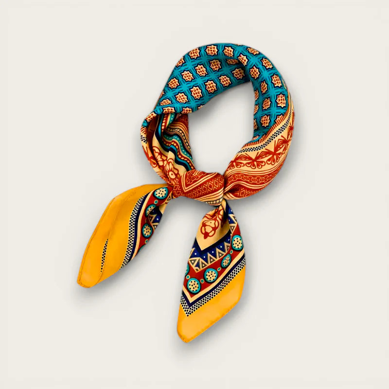 Vibrant turquoise orange patterned satin head scarf knotted with yellow ends