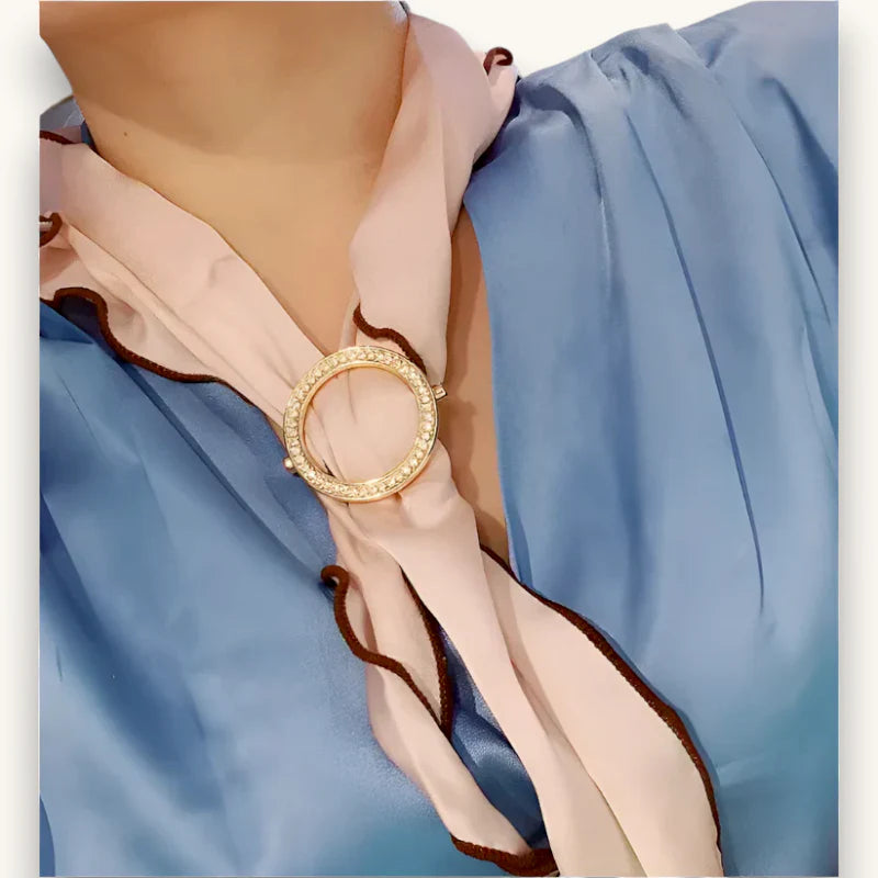 Gold-toned Scarf Holder Ring brooch with sparkling stones on pink silk scarf
