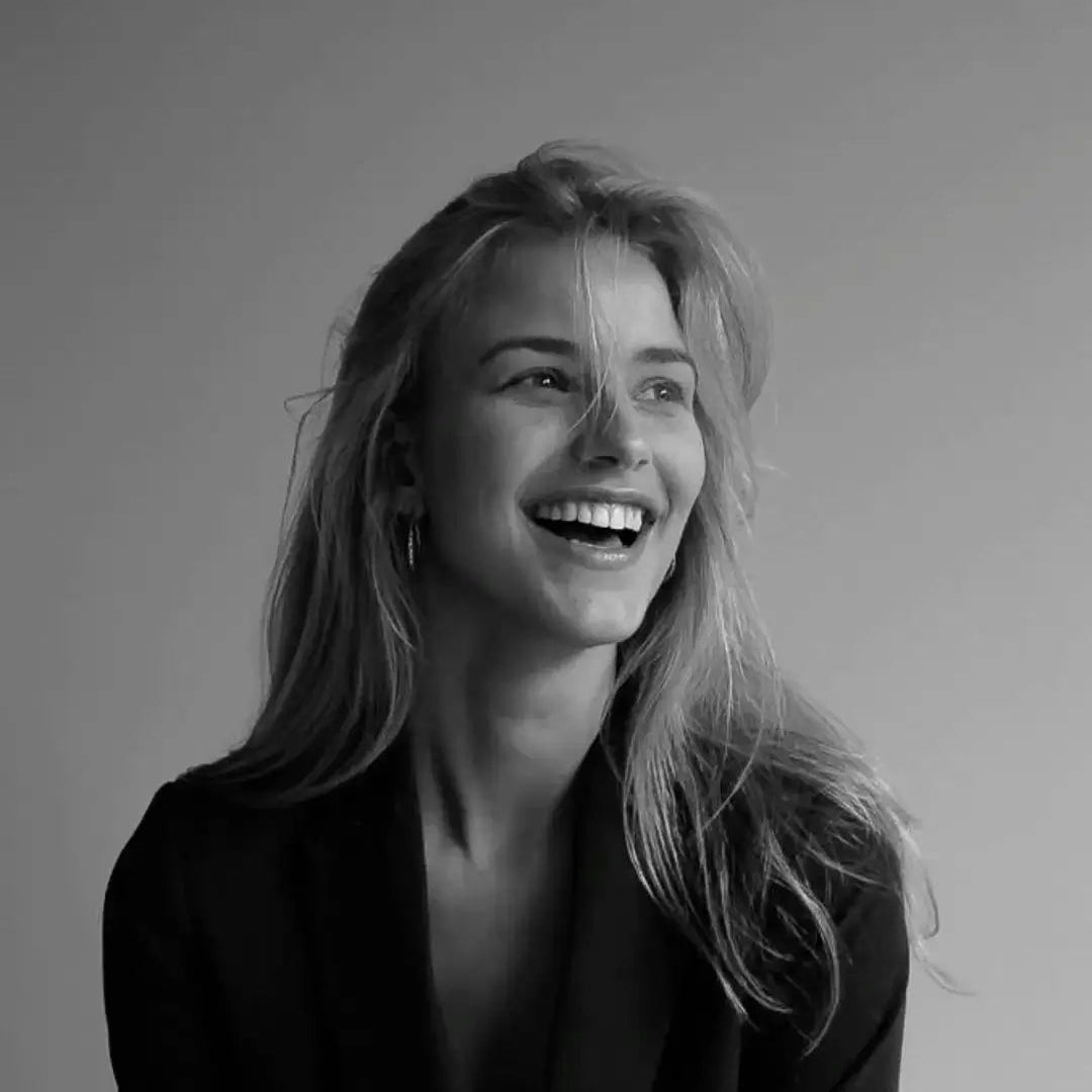 Black and white portrait of a woman with a neutral background