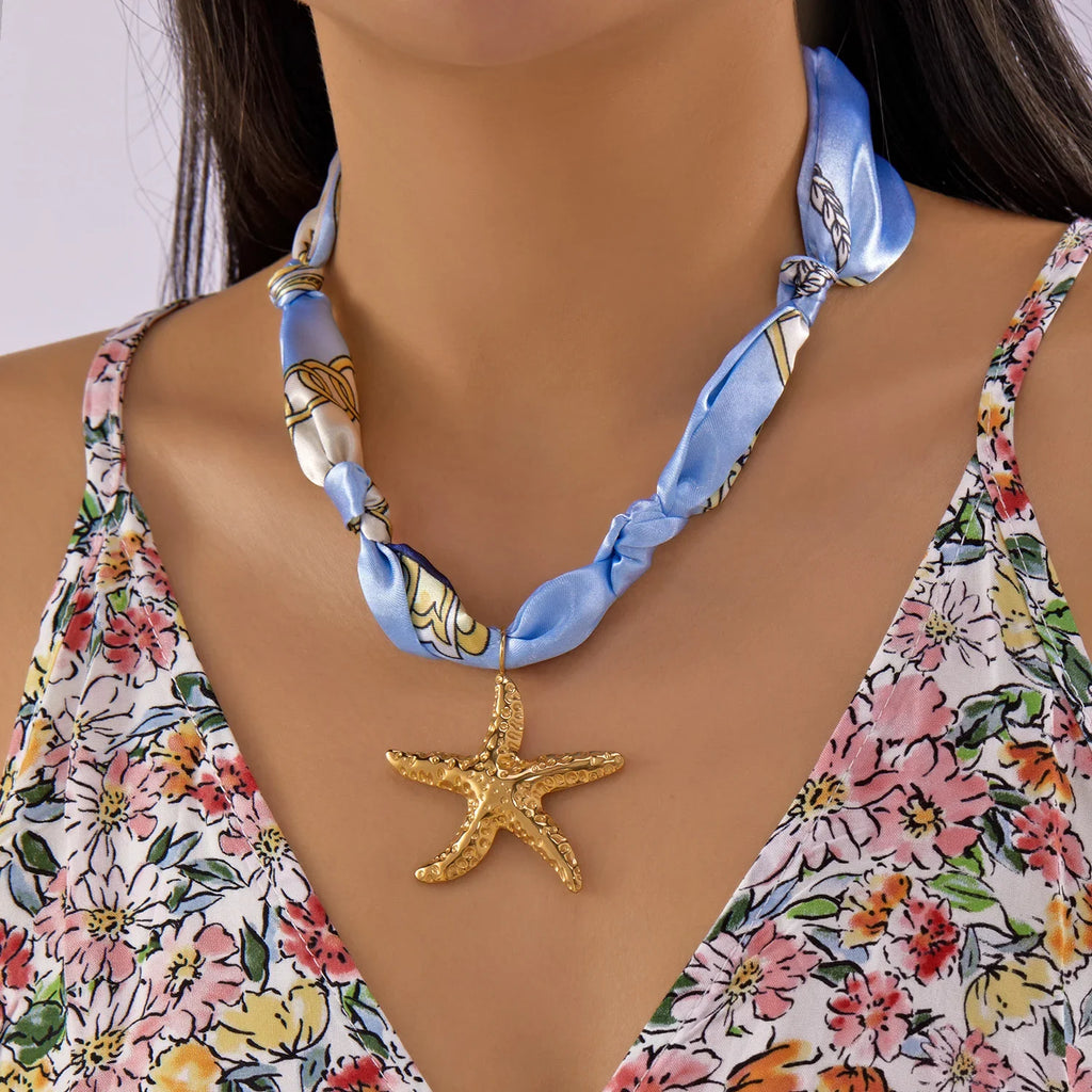 Delicate light blue silk scarf necklace with gold starfish pendant