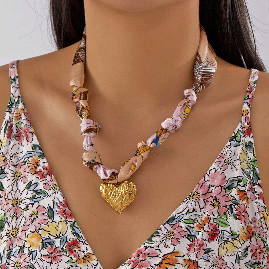 Scarf necklace with charm: delicate multi-colored silk scarf and textured gold heart pendant