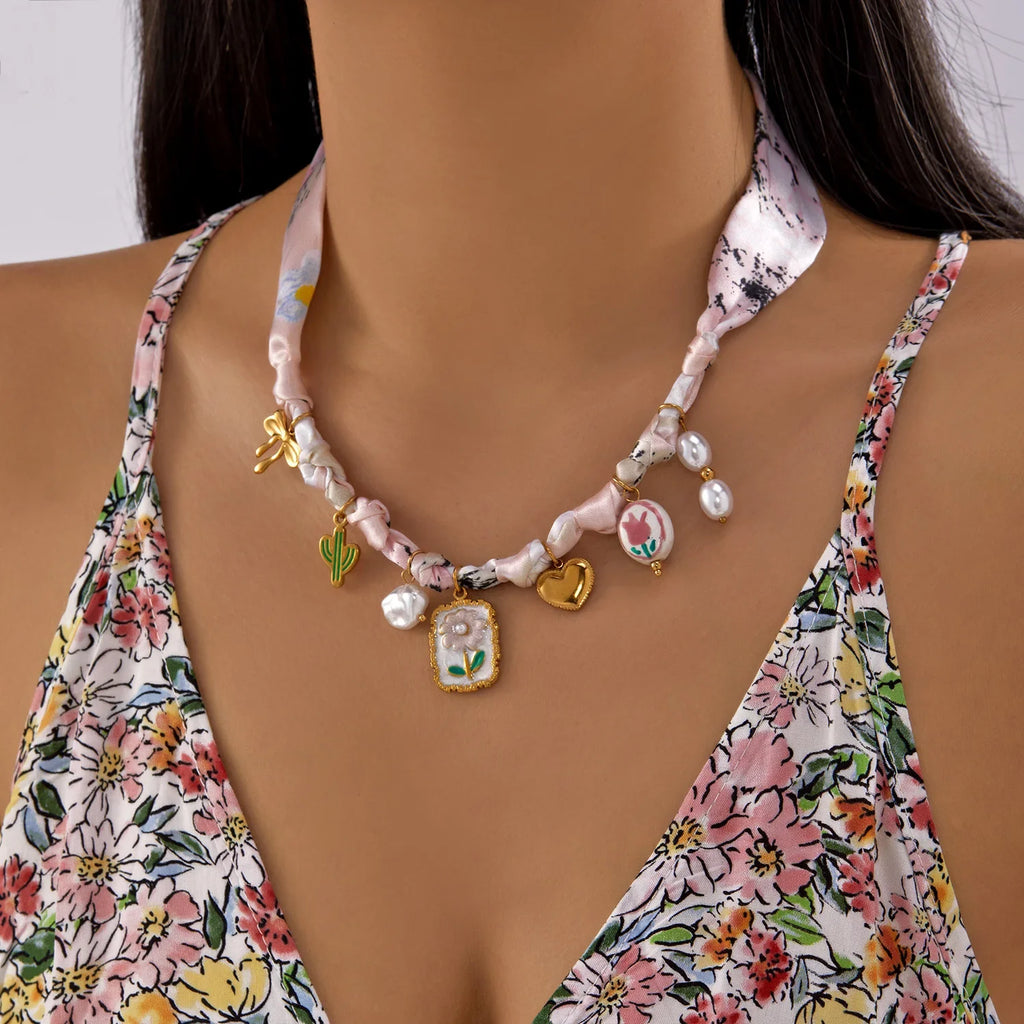 Scarf necklace with charm: pink satin ribbon, gold cactus, heart, floral pendants