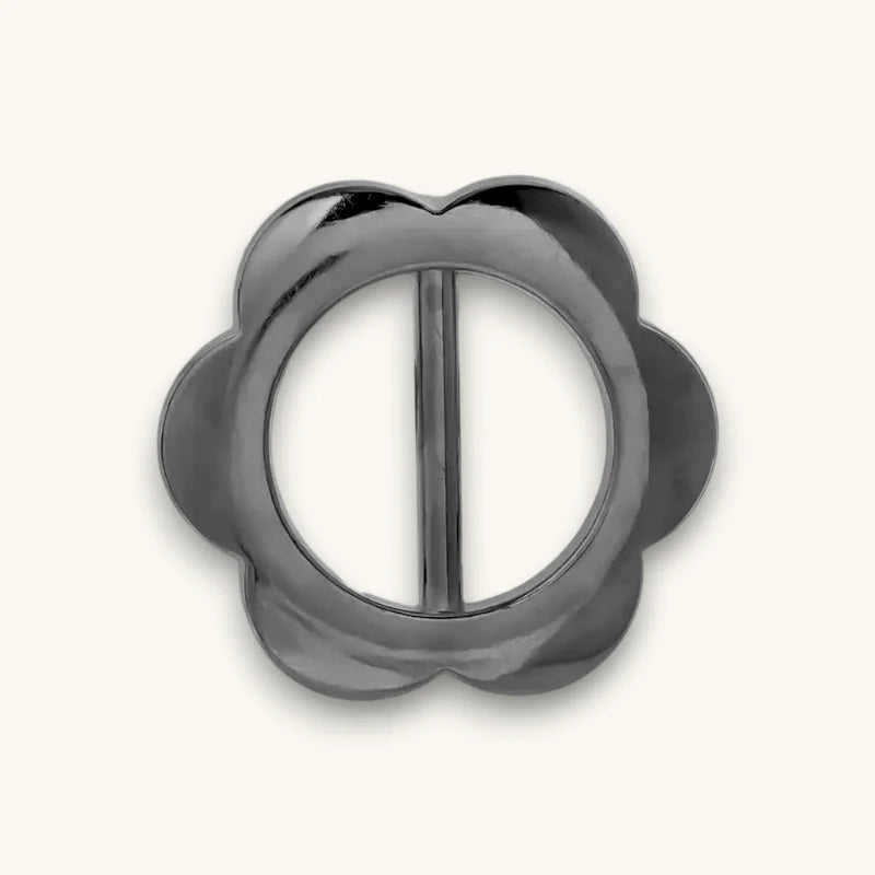 Sleek matte black Scarf Slide buckle with flower design and vertical bars