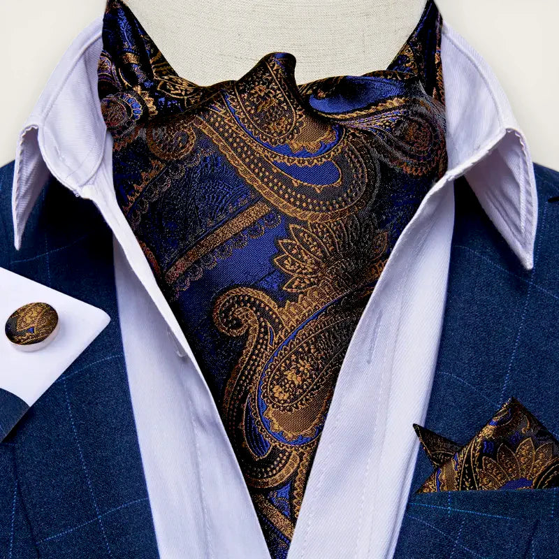 Silk Ascot Tie: richly patterned blue and gold paisley cravat on white collar