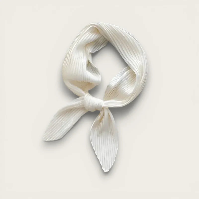 Delicate ivory pleated silk head scarf tied in neat knot