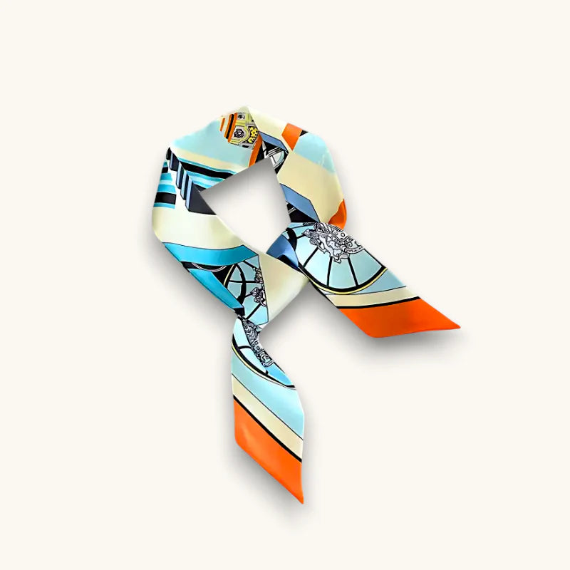 Vibrant geometric silk scarf bag in blue, orange, cream, black accents