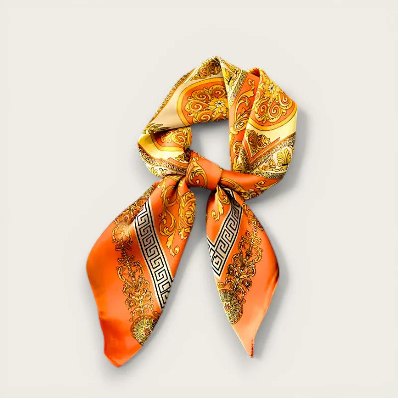 Vibrant orange silk scarf hair wrap with gold black baroque patterns, knotted