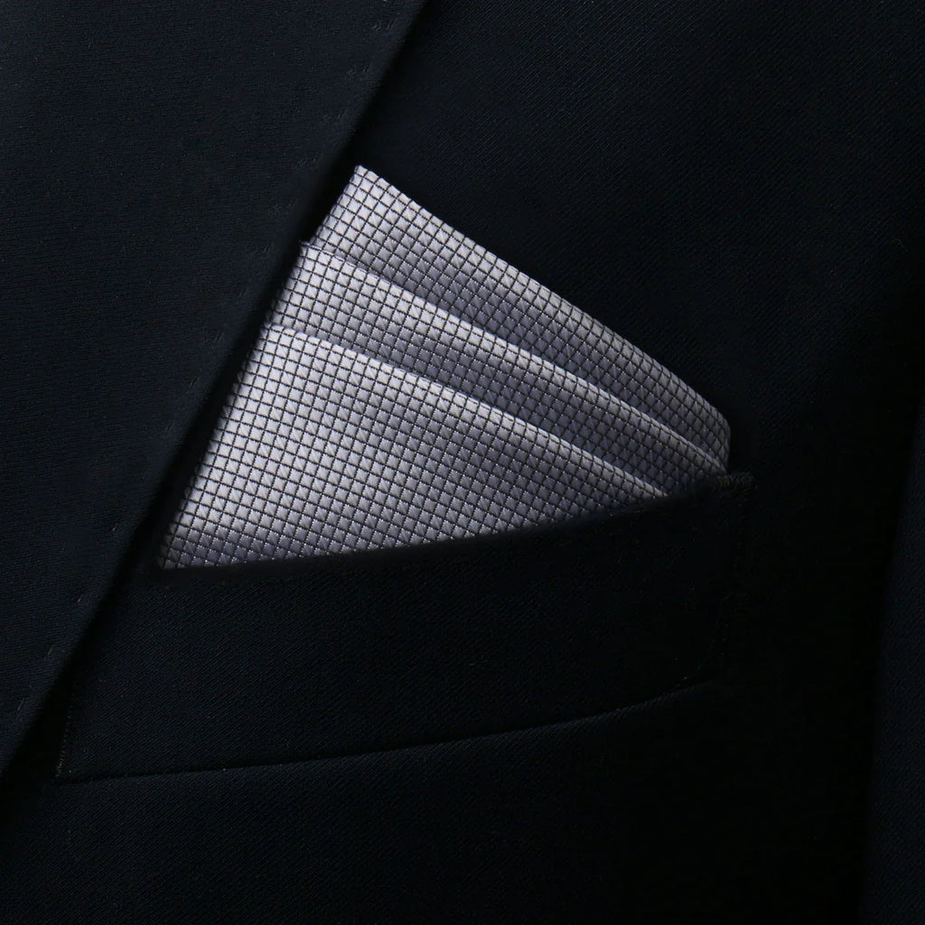 Silver pocket square with woven grid pattern in black suit pocket