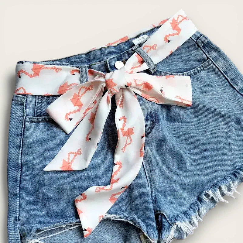 Skinny Scarf Belt: white silk scarf with coral flamingo prints on denim shorts