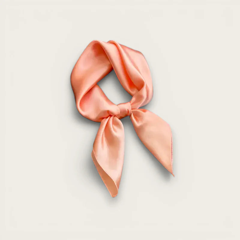 Soft peach silk Solid Square Scarf tied in neat knot with flowing ends