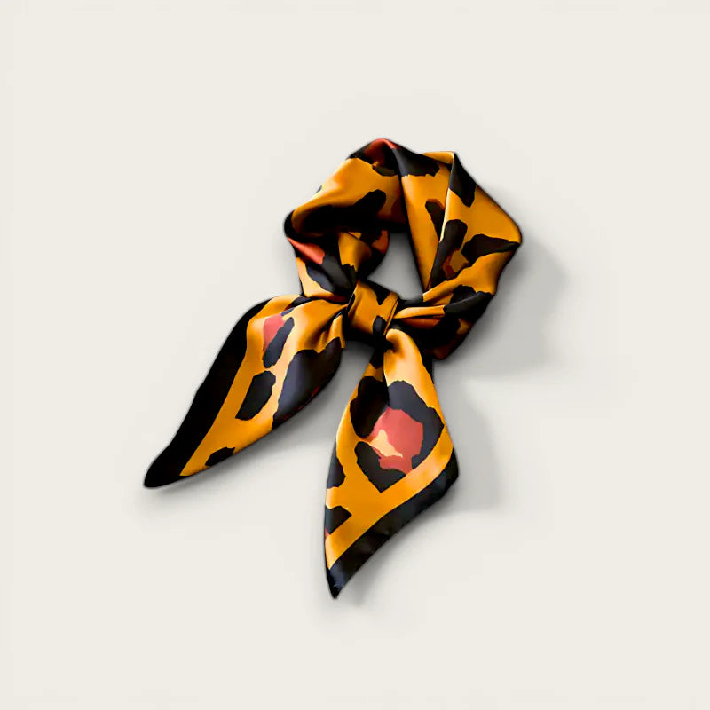 Square Leopard Scarf in vibrant orange black print neatly knotted