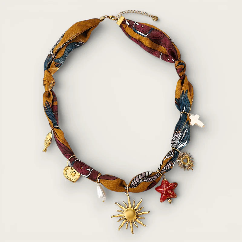 Sun Scarf Necklace with vibrant patterned silk, gold and red charms