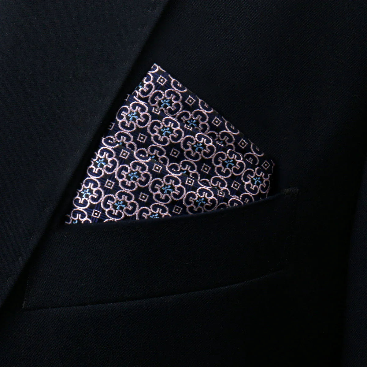 Tuxedo pocket square in navy blue with silver and light blue geometric motifs