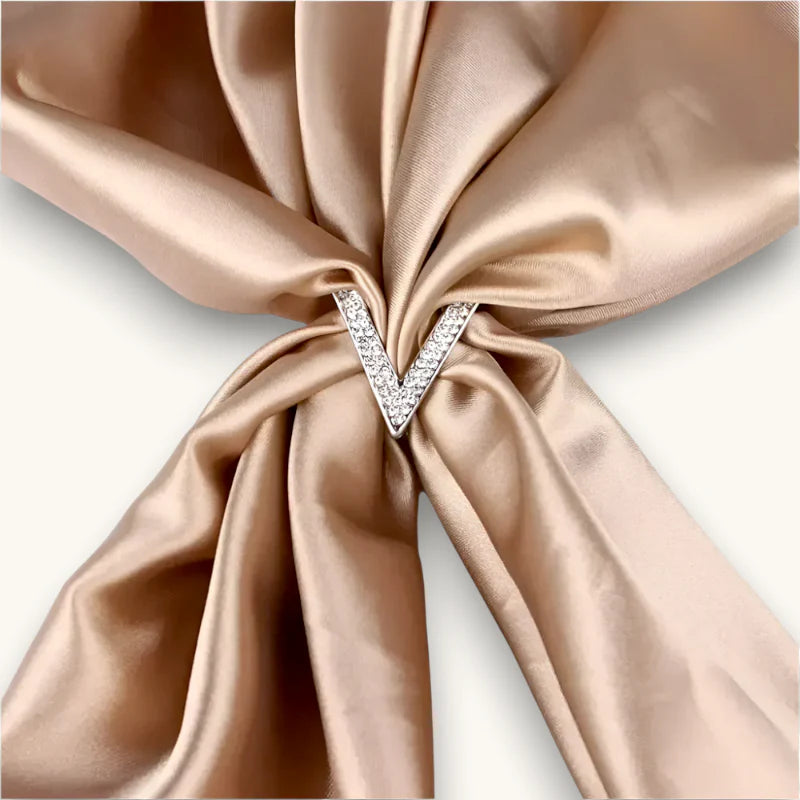 Sparkling V-shaped scarf ring brooch with clear crystals in silver frame