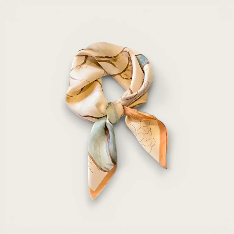Womens beige silk scarf delicately tied with peach botanical print