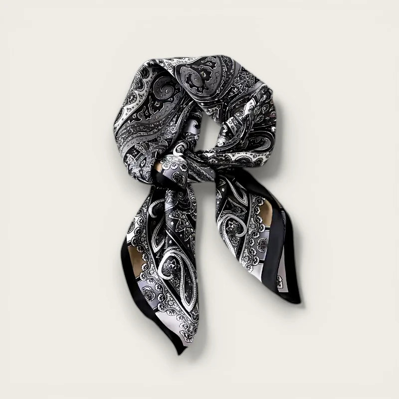 Elegant womens black silk paisley scarf with intricate swirling patterns
