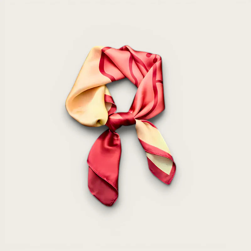 Womens pink silk scarf with vibrant coral cream waves in neat knot