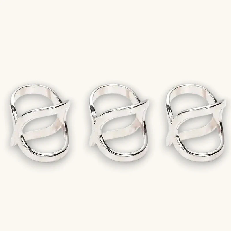 Three sleek silver womens scarf rings with open-loop design