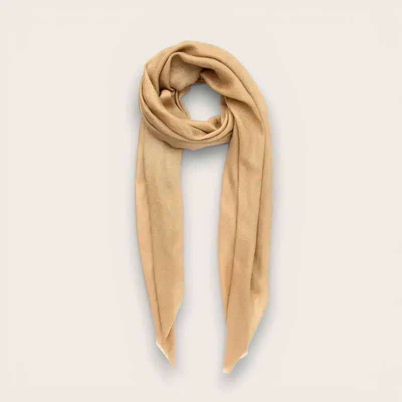 Womens camel-colored cashmere scarf with smooth texture and elegant drape