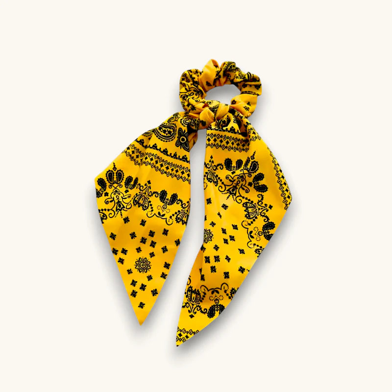 Yellow bow scrunchie with vibrant black paisley floral bandana pattern