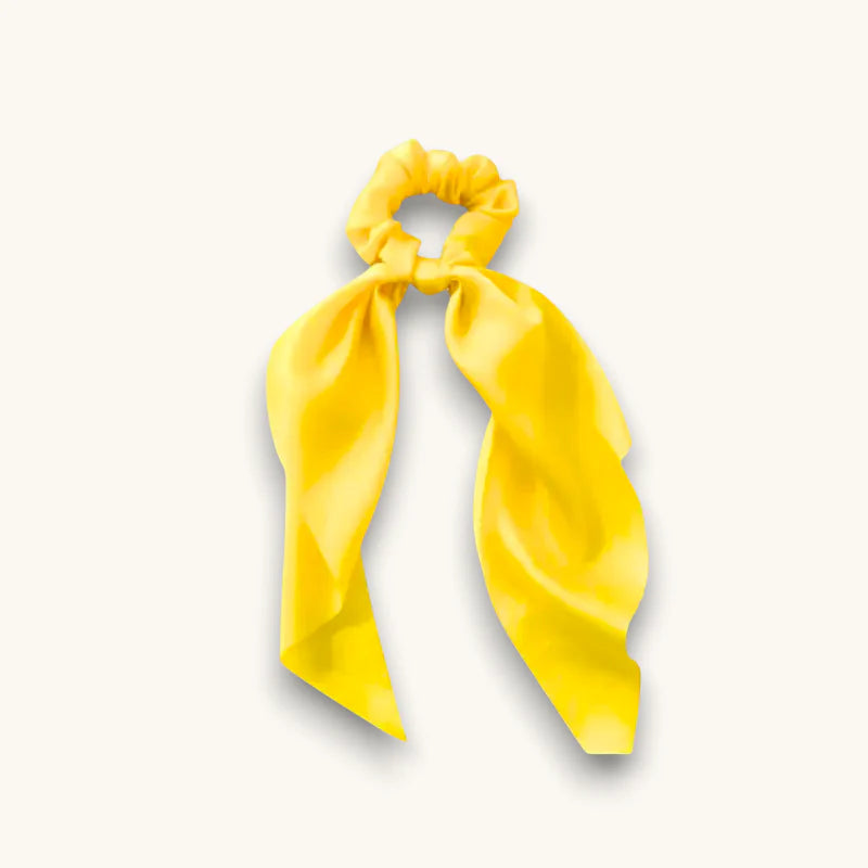 Yellow scarf scrunchie with vibrant satin scrunchie and flowing ribbon bow